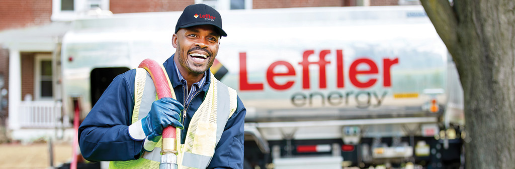 Service tech in front of Leffler oil truck