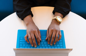 Hands typing on laptop 