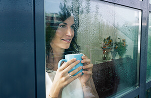 Woman looking out the window