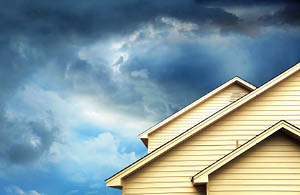 Storm clouds above house