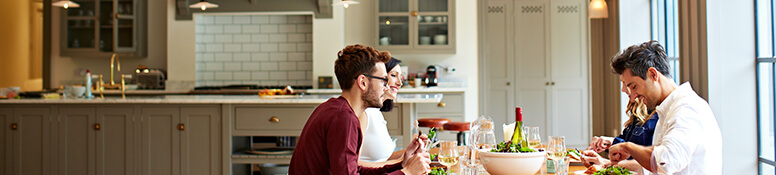 Couples eating at table