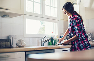 Woman washing dishes