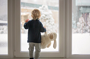 Child looking out window